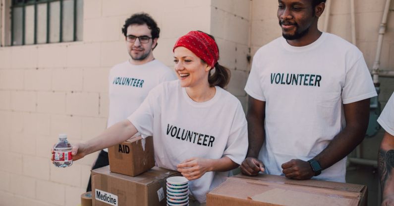 Volunteering Abroad - Three People Donating Goods