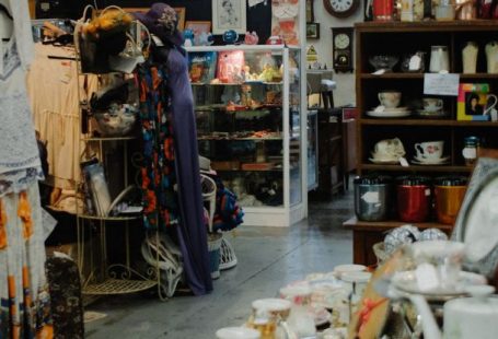 Charities - View of Shelves with Tableware in a Thrift Store