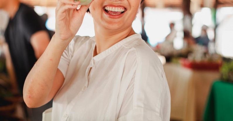 Local Nonprofits - Happy ethnic woman with salad leaf
