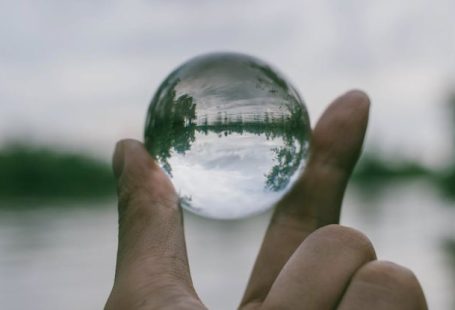 Transparency - Close-Up Photography of Person Holding Crystal Ball
