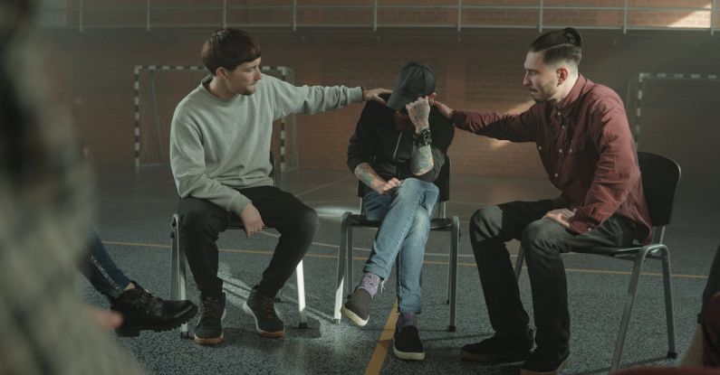 Peer Support - Men Consoling a Member of a Group Therapy